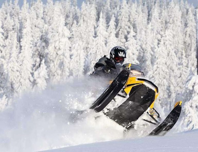 "Experience thrilling snowmobiling adventures in Gulmarg's snowy wonderland."
